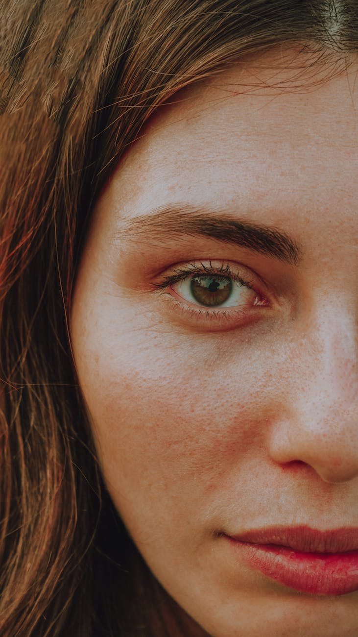 a close up shot of a woman s face